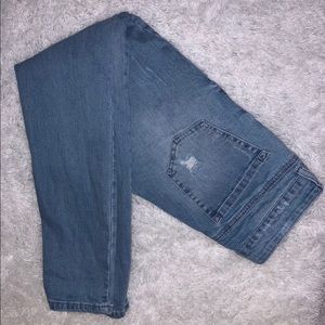 Woman distressed blue jeans